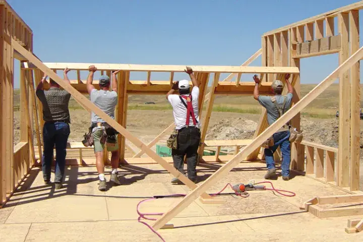 People building a house